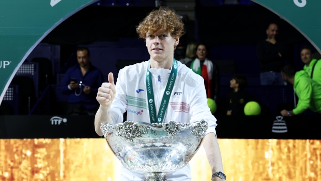 MALAGA, SPAIN - NOVEMBER 26: Jannik Sinner of Italy celebrates with the Davis Cup Trophy after their teams victory during the Davis Cup Final match against Australia at Palacio de Deportes Jose Maria Martin Carpena on November 26, 2023 in Malaga, Spain. (Photo by Clive Brunskill/Getty Images for ITF)