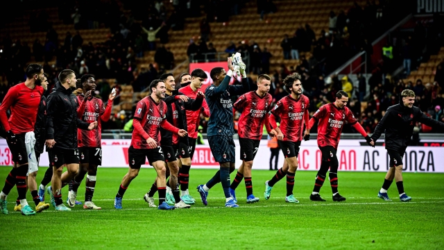 AC Milan's players players celebrate their victory at the end of the Serie A football match between AC Milan and Frosinone at San Siro stadium in Milan, on December 2, 2023. (Photo by Piero CRUCIATTI / AFP)