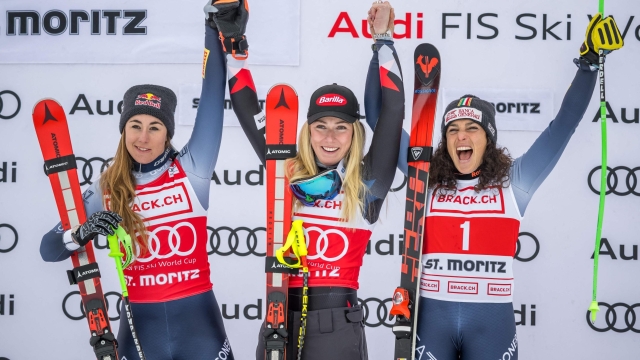 (LtoR) Second placed Italy's Sofia Goggia, Winner US skier Mikaela Shiffrin and third placed Italy's Federica Brignone pose during the podium ceremony of the Women's Downhill race at the FIS Alpine Skiing World Cup event in St. Moritz, Switzerland, on December 9, 2023. (Photo by Fabrice COFFRINI / AFP)