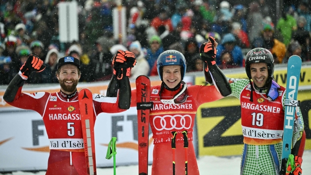 LtoR, Second placed Austria's Marco Schwarz, first placed, Switzerland's Marco Odermatt  and third placed Andorra's Joan Verdu celebrate on the podium after the Men's Giant Slalom event of the FIS Alpine Ski World Championship 2023 in Val d'Isere, French Savoy, on December 9, 2023. (Photo by Jeff PACHOUD / AFP)