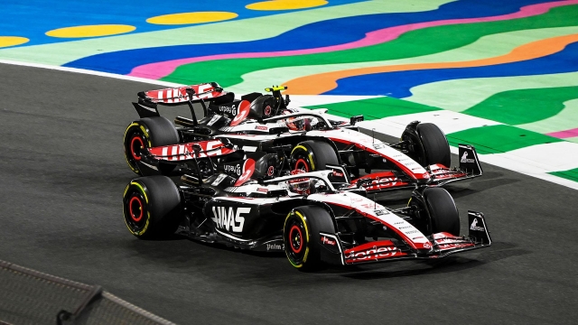 JEDDAH STREET CIRCUIT, SAUDI ARABIA - MARCH 19: Kevin Magnussen, Haas VF-23, leads Nico Hulkenberg, Haas VF-23 during the Saudi Arabian GP at Jeddah Street Circuit on Sunday March 19, 2023 in Jeddah, Saudi Arabia. (Photo by Mark Sutton / LAT Images)
