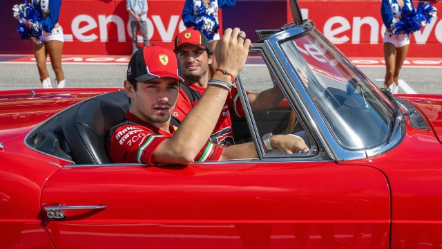 Ferrari's Monegasque driver Charles Leclerc and Ferrari's Spanish driver Carlos Sainz Jr., take part in the drivers' parade ahead the 2023 United States Formula One Grand Prix at the Circuit of the Americas in Austin, Texas, on October 22, 2023. (Photo by Jim WATSON / AFP)