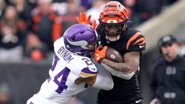 CINCINNATI, OHIO - DECEMBER 16: Joe Mixon #28 of the Cincinnati Bengals is tackled with the ball on a carry in the fourth quarter of the game against the Minnesota Vikings at Paycor Stadium on December 16, 2023 in Cincinnati, Ohio.   Jeff Dean/Getty Images/AFP (Photo by Jeff Dean / GETTY IMAGES NORTH AMERICA / Getty Images via AFP)