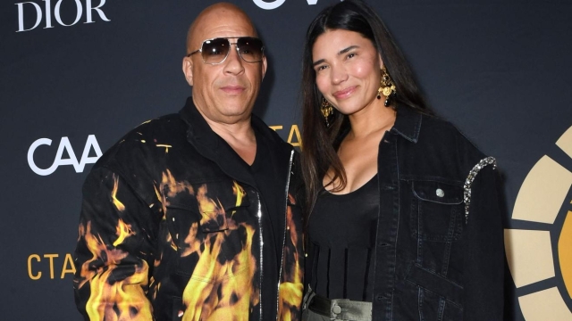 US actor Vin Diesel (L) and wife Paloma Jimenez arrive for the Charlize Theron Africa outreach project block party at the Universal Studios Backlot in Universal City, California, on May 20, 2023. (Photo by VALERIE MACON / AFP)