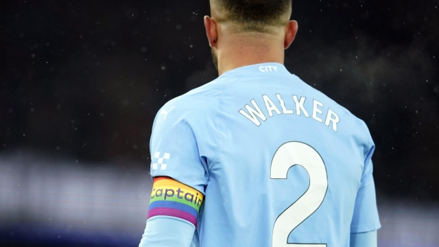 Manchester City's Kyle Walker wears a rainbow captain armband during the English Premier League soccer match between Manchester City and Tottenham Hotspur at Etihad stadium in Manchester, England, Sunday, Dec. 3, 2023. The rainbow armbands are part of a campaign supported by the Premier League to promote positive attitudes towards the LGBT+ community. (AP Photo/Dave Thompson)