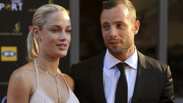FILE - In this Nov. 4, 2012 file photo, South African Olympic athlete Oscar Pistorius, right, and Reeva Steenkamp arrive for an awards ceremony in Johannesburg, South Africa.  Pistorius could be granted parole on Friday, Nov. 24, 2023 after nearly 10 years in prison for killing his girlfriend. The double-amputee Olympic runner was convicted of a charge comparable to third-degree murder for shooting Reeva Steenkamp in his home in 2013. He has been in prison since late 2014.  (Citypress,Lucky Nxumalo, via AP, File) SOUTH AFRICA OUT
