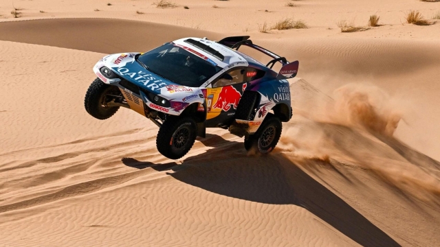 TOPSHOT - Nasser Racing's Qatari driver Nasser Al-Attiyah and his French co-driver Mathieu Baumel compete during Stage 3 of the Dakar Rally 2024, between Al Duwadimi and Al Salamiya, Saudi Arabia, on January 8, 2024. (Photo by PATRICK HERTZOG / AFP)