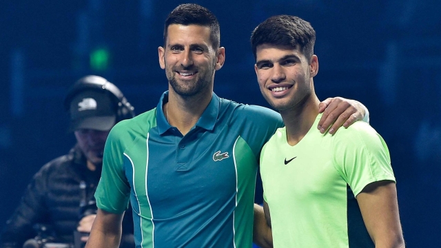 Serbia's Novak Djokovic (L) and Spain's Carlos Alcaraz Riyadh pose for a picture ahead of their Riyadh Season Tennis Cup exhibition tournament match on December 27, 2023. (Photo by AFP)