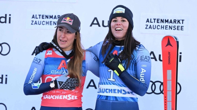 Winner Sofia Goggia (L) and third placed Nicol Delago, both of Italy, pose on the podium after the women's downhill event of the FIS Alpine Skiing World Cup in Altenmarkt-Zauchensee, Austria on January 13, 2024. (Photo by BARBARA GINDL / APA / AFP) / Austria OUT