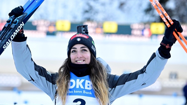 Italy's Lisa Vittozzi celebrates after winning the women's 10km pursuit event of the IBU Biathlon World Cup in Ruhpolding, southern Germany on January 14, 2024. (Photo by Tobias SCHWARZ / AFP)