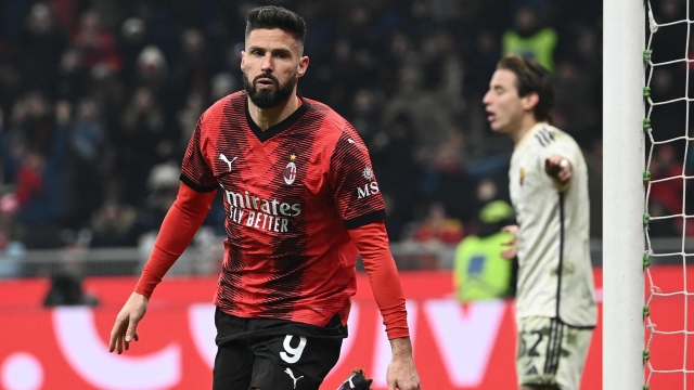 AC Milan's French forward #09 Olivier Giroud celebrates after scoring the team's second goal during the Italian Serie A football match between AC Milan and AS Roma at San Siro Stadium, in Milan on January 14, 2024. (Photo by Isabella BONOTTO / AFP)