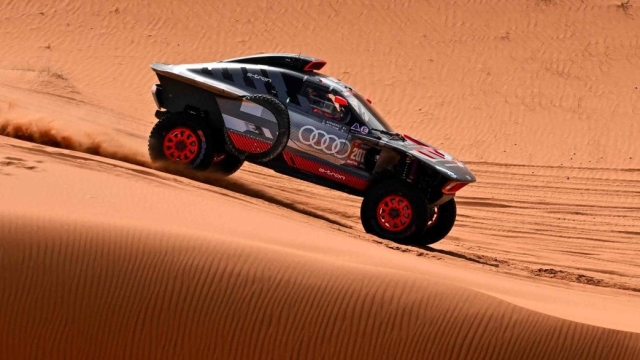 Team Audi Sport's Swedish driver Mattias Ekstrom and his Swedish co-driver Emil Bergkvist steer their car in the dunes during the stage 8 of the 2024 Dakar Rally, between Al Duwadimi and Hail, Saudi Arabia, on January 15, 2024. (Photo by PATRICK HERTZOG / AFP)