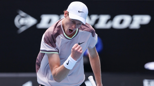 Italy's Jannik Sinner reacts after a point against Russia's Karen Khachanov during their men's singles match on day eight of the Australian Open tennis tournament in Melbourne on January 21, 2024. (Photo by David GRAY / AFP) / -- IMAGE RESTRICTED TO EDITORIAL USE - STRICTLY NO COMMERCIAL USE --