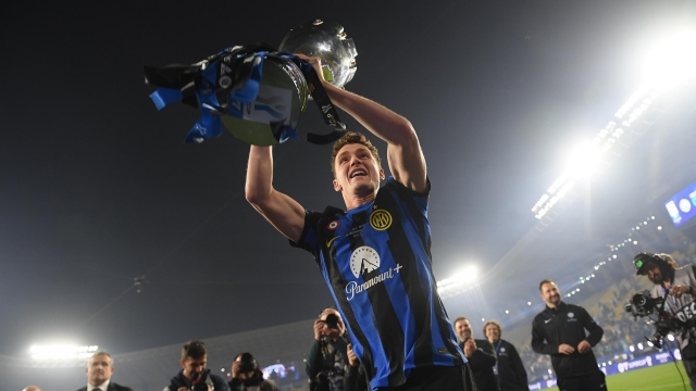 RIYADH, SAUDI ARABIA - JANUARY 22:  Benjamin Pavard of FC Internazionale poses for a photo with the Italian EA Sports FC Supercup Final trophy at full-time following victory in the Italian EA Sports FC Supercup Final match between SSC Napoli and FC Internazionale at Al-Awwal Stadium on January 22, 2024 in Riyadh, Saudi Arabia. (Photo by Mattia Pistoia - Inter/Inter via Getty Images)