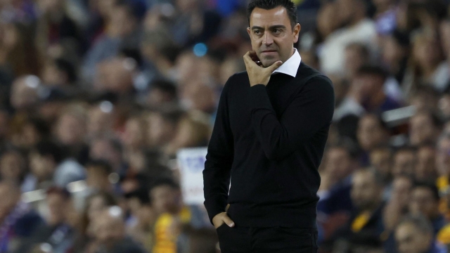 Barcelona's head coach Xavi Hernandez stands by the touchline during a Spanish La Liga soccer match between Barcelona and Real Sociedad at Camp Nou stadium in Barcelona, Spain, Saturday, May 20, 2023. (AP Photo/Joan Monfort)