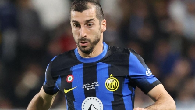 Inter Milan's Armenian midfielder #22 Henrikh Mkhitaryan runs with the ball during the Italian Super Cup final football match between Napoli and Inter Milan at Al-Awwal Park Stadium in Riyadh, on January 22, 2024. (Photo by AFP)