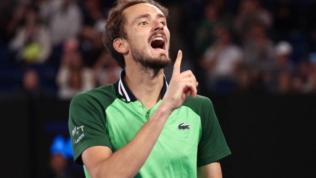 Russia's Daniil Medvedev celebrates after victory against Germany's Alexander Zverev during their men's singles semi-final match on day 13 of the Australian Open tennis tournament in Melbourne early on January 27, 2024. (Photo by David GRAY / AFP) / -- IMAGE RESTRICTED TO EDITORIAL USE - STRICTLY NO COMMERCIAL USE --