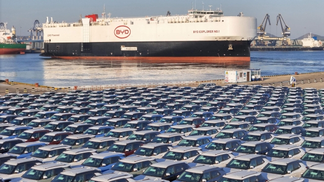 The photo taken on January 10, 2024 shows electric cars for export waiting to be loaded on the "BYD Explorer NO.1", a domestically manufactured vessel intended to export Chinese automobiles, at Yantai port, in eastern China's Shandong province. (Photo by AFP) / China OUT