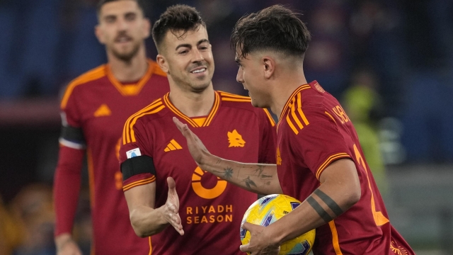 Roma's Paulo Dybala, right, celebrates after scoring from penalty against Cagliari during a Serie A soccer match between Roma and Cagliari, at Rome's Olympic Stadium, on Monday, Feb. 5, 2024. (AP Photo/Andrew Medichini)