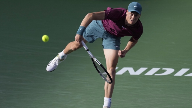 Jannik Sinner, of Italy, serves to Carlos Alcaraz, of Spain, during a semifinal match at the BNP Paribas Open tennis tournament Saturday, March 18, 2023, in Indian Wells, Calif. (AP Photo/Mark J. Terrill)