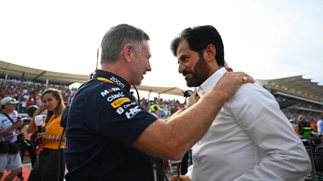 Red Bull Racing's British team principal Christian Horner (L) speaks with FIA President Mohammed Ben Sulayem before the Sprint at the Circuit of the Americas in Austin, Texas, on October 21, 2023, ahead of the United States Formula One Grand Prix. (Photo by Chandan Khanna / AFP)