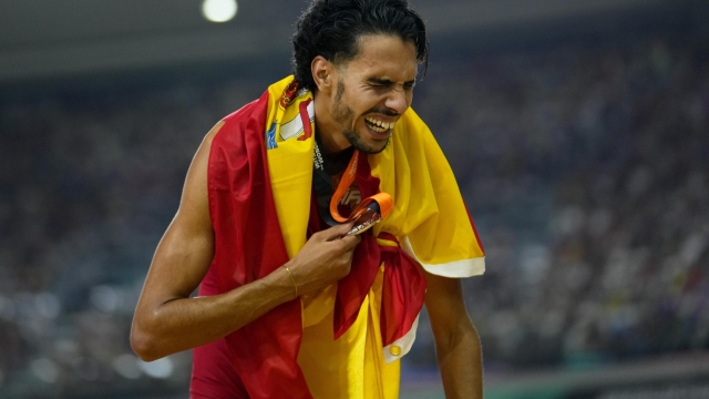 Mohamed Katir, of Spain reacts after taking the silver medal in the final of the Men's 5000-meters during the World Athletics Championships in Budapest, Hungary, Sunday, Aug. 27, 2023. (AP Photo/Petr David Josek)