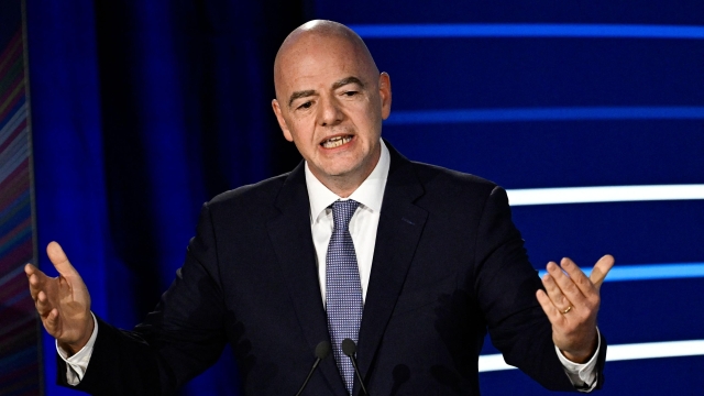 President of FIFA Gianni Infantino gestures as he delivers a speech during the 48th UEFA ordinary Congress held at the Maison de la Mutualite in Paris on February 8, 2024. (Photo by JULIEN DE ROSA / AFP)