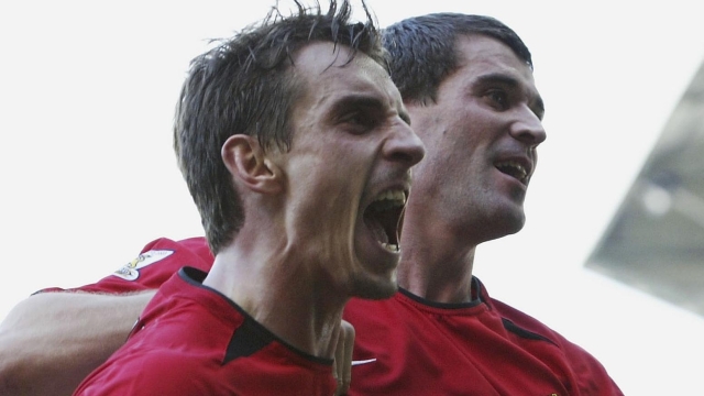 LEEDS, ENGLAND - OCTOBER 18: Roy Keane of Man Utd celebrates with Gary Neville after scoring the first goal during the FA Barclaycard Premiership match between Leeds United and Manchester United at Elland Road on October 18, 2003 in Leeds, England. (Photo by Laurence Griffiths/Getty Images)