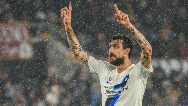 Inter Milan's Italian defender #15 Francesco Acerbi celebrates after opening the scoring during the Italian Serie A football match between AS Roma and Inter Milan at the Olympic stadium in Rome on February 10, 2024. (Photo by Alberto PIZZOLI / AFP)