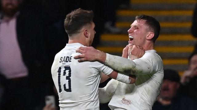England's centre Fraser Dingwall (R) celebrates after scoring the team's second try with England's centre Henry Slade during the Six Nations international rugby union match between England and Wales at Twickenham Stadium in south-west London, on February 10, 2024. (Photo by Glyn KIRK / AFP)