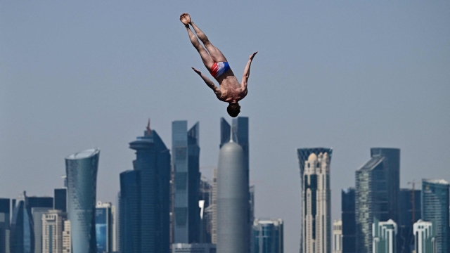 Frances Gary Hunt competes in the final of the men's high diving event during the 2024 World Aquatics Championships at Doha Port in Doha on February 15, 2024. (Photo by MANAN VATSYAYANA / AFP)