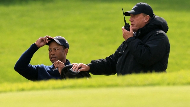 PACIFIC PALISADES, CALIFORNIA - FEBRUARY 16: Tiger Woods of the United States speaks with a rules official after withdrawing from the tournament due to illness on the sixth hole during the second round of The Genesis Invitational at Riviera Country Club on February 16, 2024 in Pacific Palisades, California.   Sean M. Haffey/Getty Images/AFP (Photo by Sean M. Haffey / GETTY IMAGES NORTH AMERICA / Getty Images via AFP)