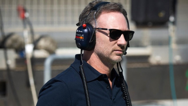 Red Bull Racing's team principal Christian Horner crosses the pit lane during the first day of the Formula One pre-season testing at the Bahrain International Circuit in Sakhir on February 21, 2024. (Photo by Andrej ISAKOVIC / AFP)