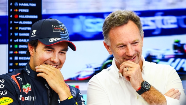 BAHRAIN, BAHRAIN - FEBRUARY 22: Sergio Perez of Mexico and Oracle Red Bull Racing talks with Oracle Red Bull Racing Team Principal Christian Horner in the garage during day two of F1 Testing at Bahrain International Circuit on February 22, 2024 in Bahrain, Bahrain. (Photo by Mark Thompson/Getty Images)
