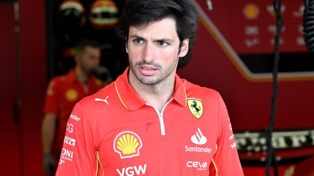 Ferrari's Spanish driver Carlos Sainz Jr is seen in the garage during the second day of the Formula One pre-season testing at the Bahrain International Circuit in Sakhir on February 22, 2024. (Photo by Andrej ISAKOVIC / AFP)