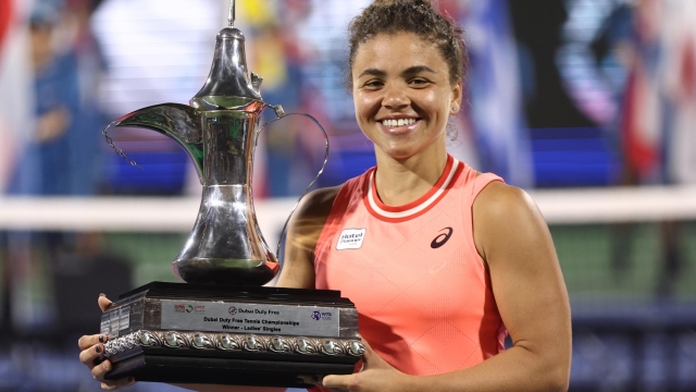 DUBAI, UNITED ARAB EMIRATES - FEBRUARY 24: Jasmine Paolini of Italy Anna Kalinskaya holds her winners trophy after victory against  Anna Kalinskaya in their Women's Singles Final match during the Dubai Duty Free Tennis Championships, part of the Hologic WTA Tour at Dubai Duty Free Tennis Stadium on February 24, 2024 in Dubai, United Arab Emirates. (Photo by Francois Nel/Getty Images)