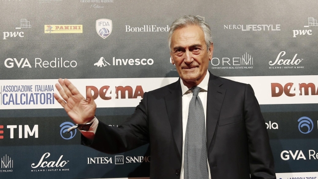 FILE - FIGC President Gabriele Gravina poses for photographer as he arrives for the Gran Gala' soccer awards ceremony, in Milan, Italy, on Dec. 2, 2019. Italian soccer federation president and UEFA vice president Gabriele Gravina has been placed under investigation by Rome prosecutors for alleged embezzlement and money laundering linked to an auction for TV rights when he led the third division in 2018. Gravina volunteered to meet with the prosecutors and denies any wrongdoing. (AP Photo/Antonio Calanni, File)