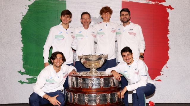MALAGA, SPAIN - NOVEMBER 26: (L-R) Lorenzo Musetti, Matteo Arnaldi, Filippo Volandri, Jannik Sinner, Simone Bolelli and Lorenzo Sonego of Italy pose for a photo with the Davis Cup Trophy after their teams victory during the Davis Cup Final match against Australia at Palacio de Deportes Jose Maria Martin Carpena on November 26, 2023 in Malaga, Spain. (Photo by Clive Brunskill/Getty Images for ITF)