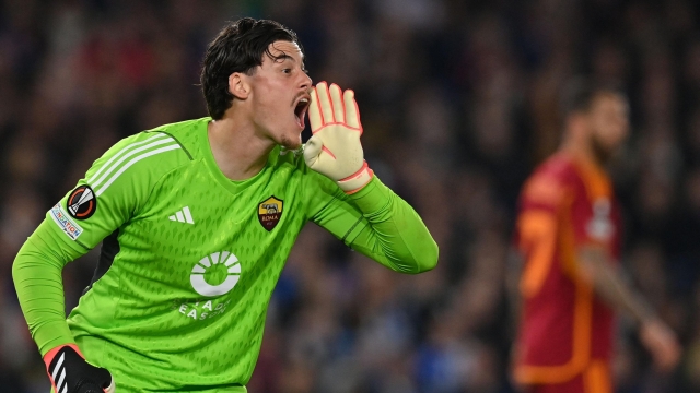 Roma's Serbian goalkeeper #99 Mile Svilar shouts to teammates during the UEFA Europa League round of 16 second leg football match between Brighton and Roma at the American Express Community Stadium in Brighton, southern England on March 14, 2024. (Photo by Glyn KIRK / AFP)