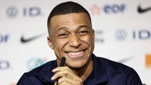 France's forward Kylian Mbappe smiles during a press conference at the Groupama Stadium in Decines-Charpieu, near Lyon, on March 22, 2024, on the eve of the friendly football match between France and Germany. (Photo by FRANCK FIFE / AFP)