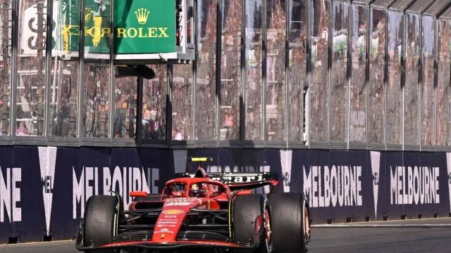 TOPSHOT - Ferrari's Spanish driver Carlos Sainz Jr wins the Australian Formula One Grand Prix at Albert Park Circuit in Melbourne on March 24, 2024. (Photo by WILLIAM WEST / AFP) / -- IMAGE RESTRICTED TO EDITORIAL USE - STRICTLY NO COMMERCIAL USE --