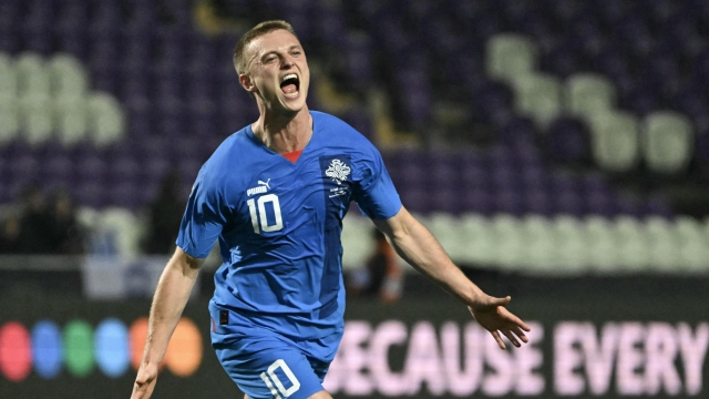 Iceland's forward #10 Albert Gudmundsson celebrates scoring his equalizing 1-1 goal during the UEFA EURO 2024 qualifier play-off semi-final football match Israel v Iceland at the Szusza Ferenc Stadium in Budapest, Hungary on March 21, 2024. (Photo by Attila KISBENEDEK / AFP)