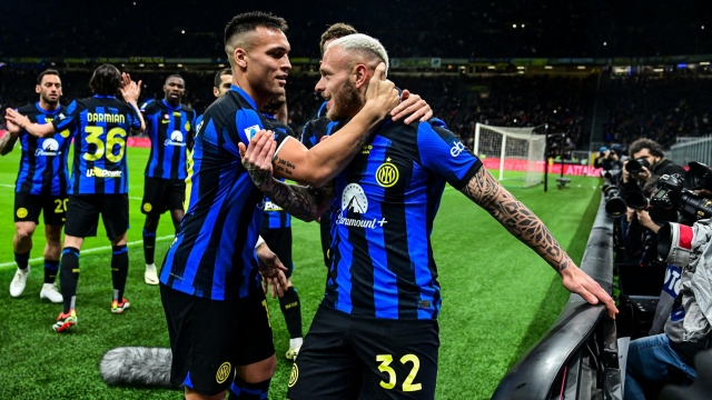 Inter Milan's Italian defender #32 Federico Dimarco (R) celebrates with Inter Milan's Argentine forward #10 Lautaro Martinez after scoring his team first goal during the Italian Serie A football match between Inter Milan and Empoli in Milan, on April 1, 2024. (Photo by Piero CRUCIATTI / AFP)