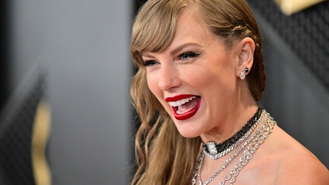 (FILES) US singer-songwriter Taylor Swift arrives for the 66th Annual Grammy Awards at the Crypto.com Arena in Los Angeles on February 4, 2024. Swift was officially named a member of the three-comma-club on April 2, 2024, as Forbes confirmed rumors estimating her wealth exceeds a billion dollars. (Photo by Robyn BECK / AFP)