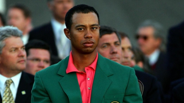 AUGUSTA, GA - APRIL 09:  Tiger Woods sits at the green jacket presentation before presenting Mickelson with the green jacket for winning The Masters at the Augusta National Golf Club after the final round on April 9, 2006 in Augusta, Georgia.  Mickelson won with the score seven under.  (Photo by Andrew Redington/Getty Images)