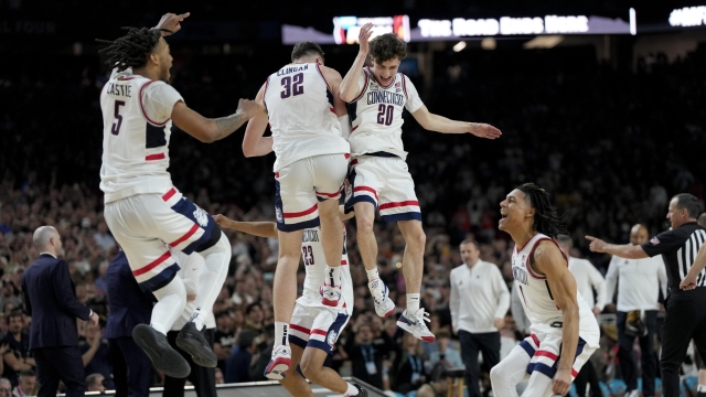UConn celebrates their win against Purdue in the NCAA college Final Four championship basketball game, Monday, April 8, 2024, in Glendale, Ariz. (AP Photo/David J. Phillip)