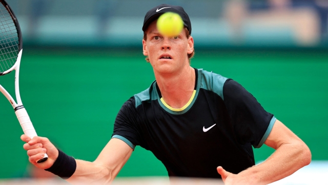 Italy's Jannik Sinner eyes the ball as he plays against US Sebastian Korda during their Monte Carlo ATP Masters Series Tournament round of 32 tennis match on the Rainier III court at the Monte Carlo Country Club on April 10, 2024. (Photo by Valery HACHE / AFP)