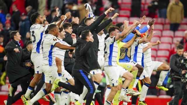 Atalanta's players celebrate after beating 3-0 Liverpool during the Europa League quarter final first leg soccer match at the Anfield stadium in Liverpool, England, Thursday, April 11, 2024. (AP Photo/Jon Super)