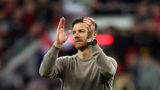LEVERKUSEN, GERMANY - APRIL 11: Xabi Alonso, Head Coach of Bayer Leverkusen, applauds the fans at full-time following the team's victory in the UEFA Europa League 2023/24 Quarter-Final first leg match between Bayer 04 Leverkusen and West Ham United FC at BayArena on April 11, 2024 in Leverkusen, Germany. (Photo by Lars Baron/Getty Images)