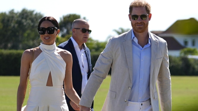 Britain's Prince Harry, right, and wife Meghan Markle, Duchess of Sussex, arrive for the 2024 Royal Salute Polo Challenge to Benefit Sentebale, Friday, April 12, 2024, in Wellington, Fla. Prince Harry, co-founding patron of the Sentebale charity, will play on the Royal Salute Sentebale Team. (AP Photo/Rebecca Blackwell)